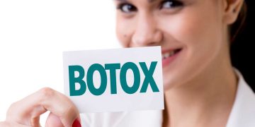 Girl is Hanging "Botox" Banner
